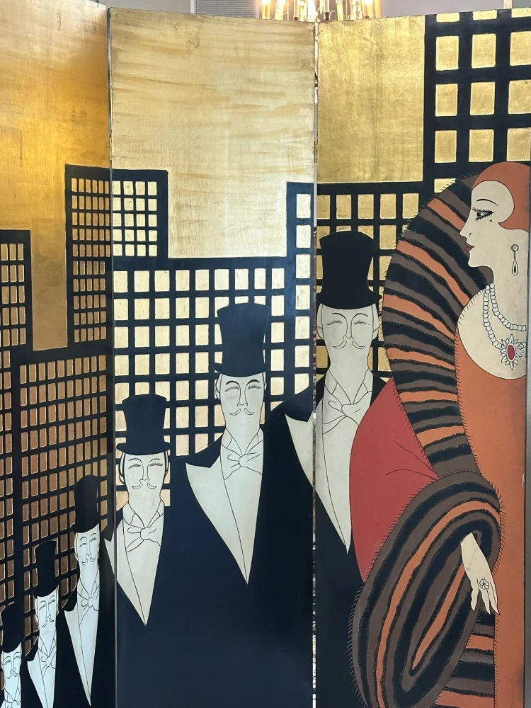 Stylized Art Deco artwork featuring formally dressed figures against a geometric city skyline.