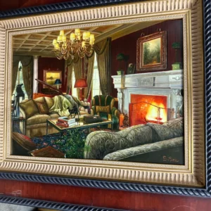 Warm, richly decorated parlor interior with upholstered seating, chandelier, artwork, and a glowing fireplace.