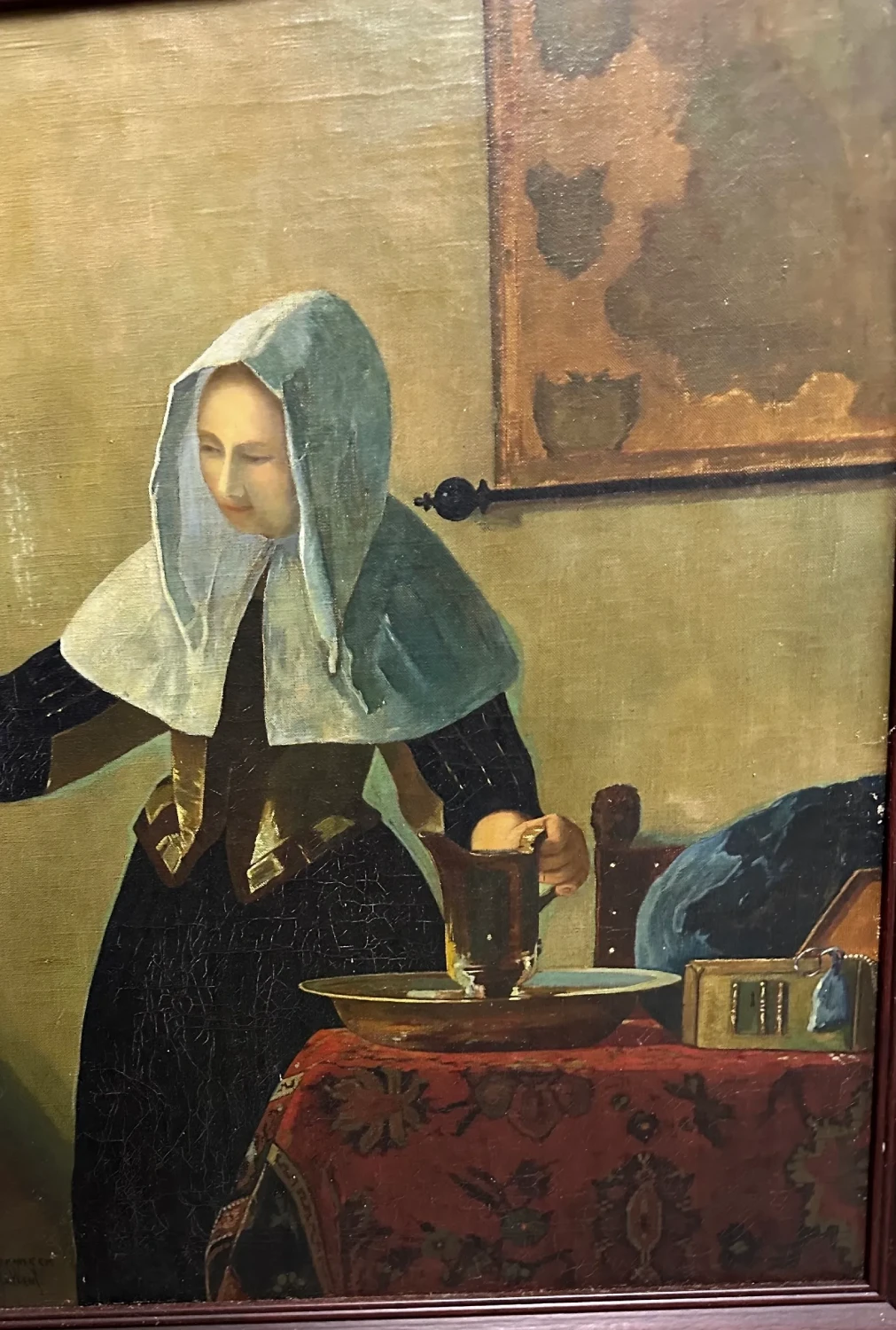 Period-style portrait of a bonneted woman seated beside a writing desk in a softly rendered interior.